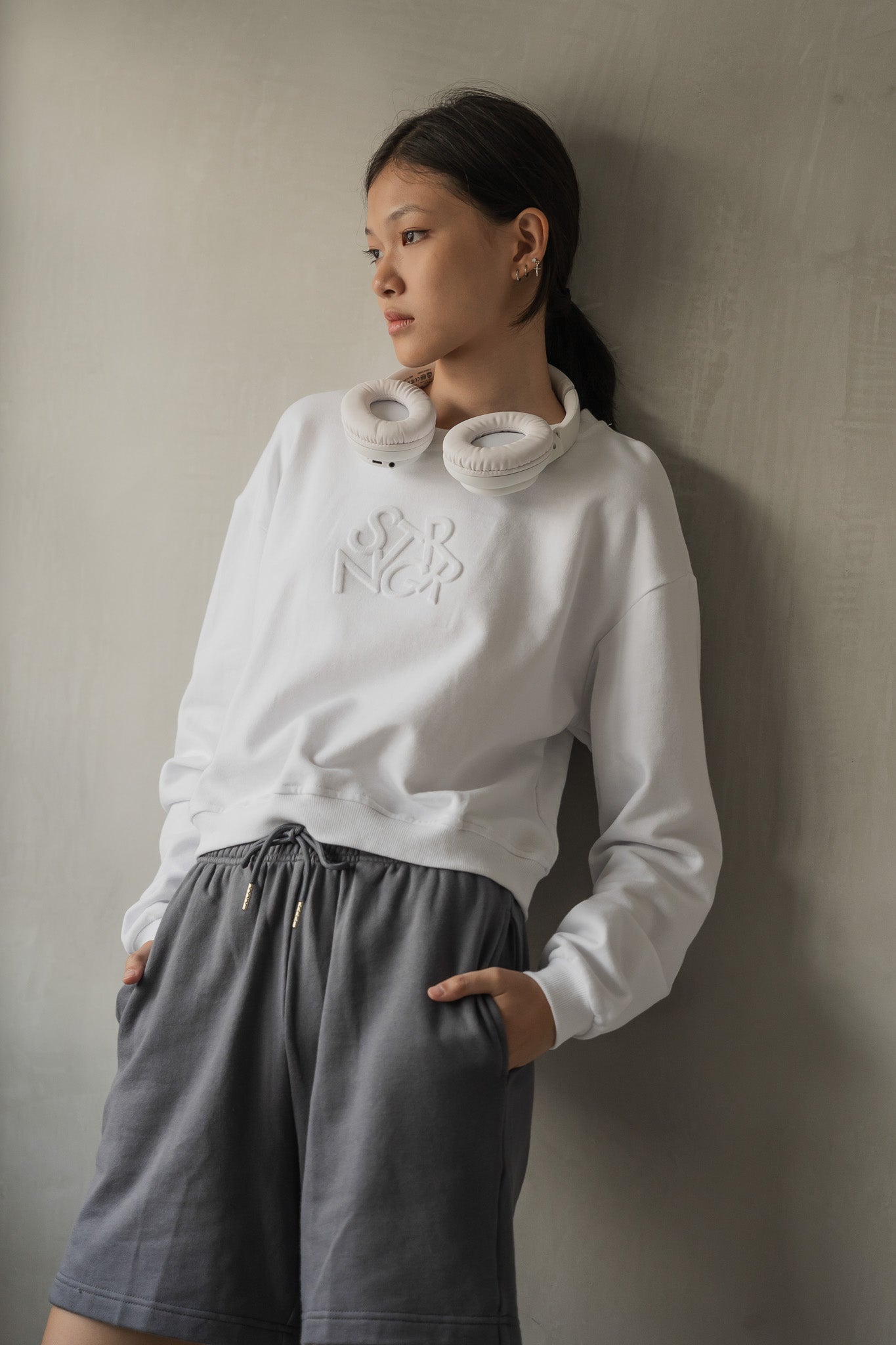 STRANGER Embossed Logo Cropped Sweatshirt in White