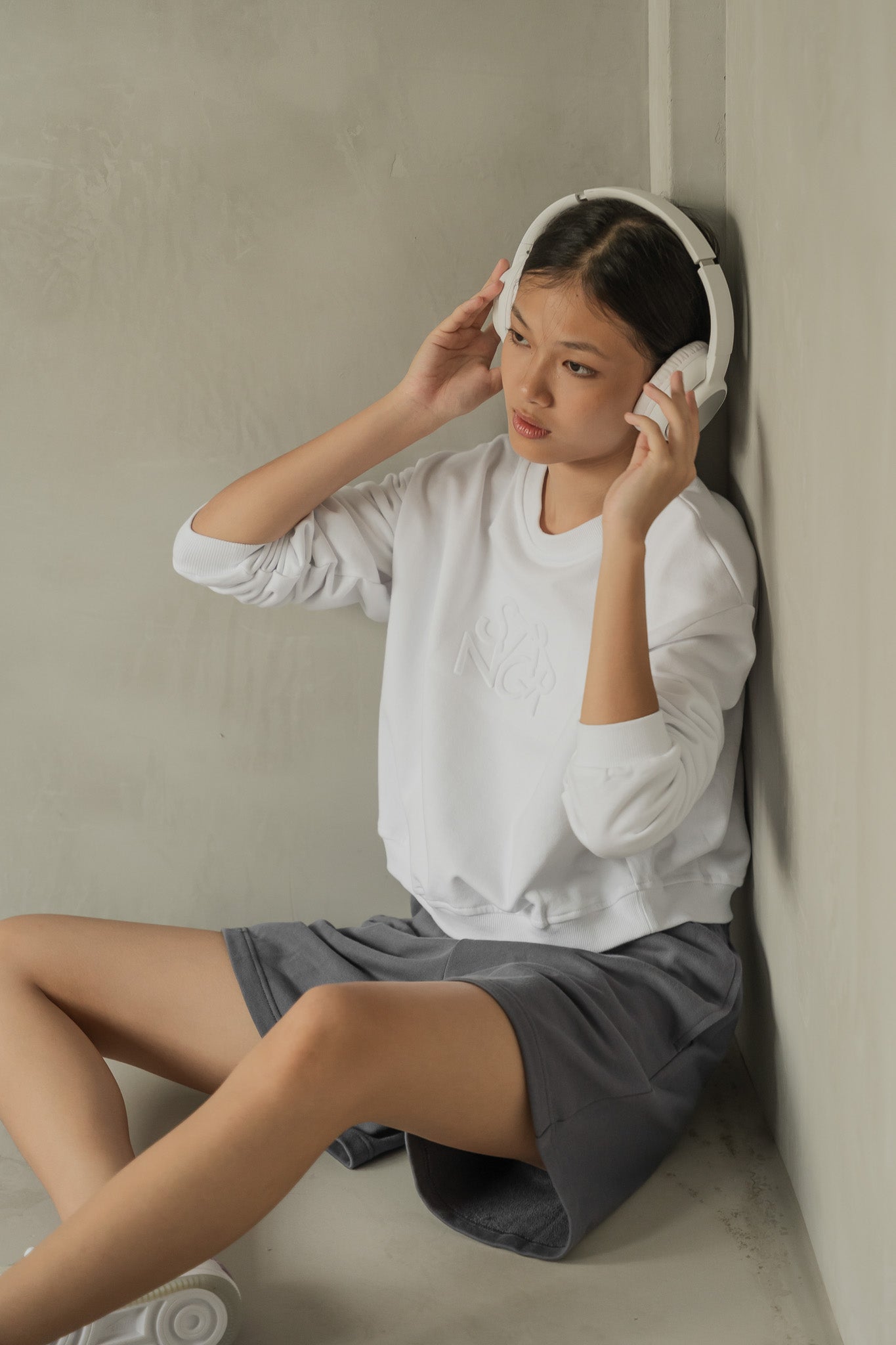 STRANGER Embossed Logo Cropped Sweatshirt in White